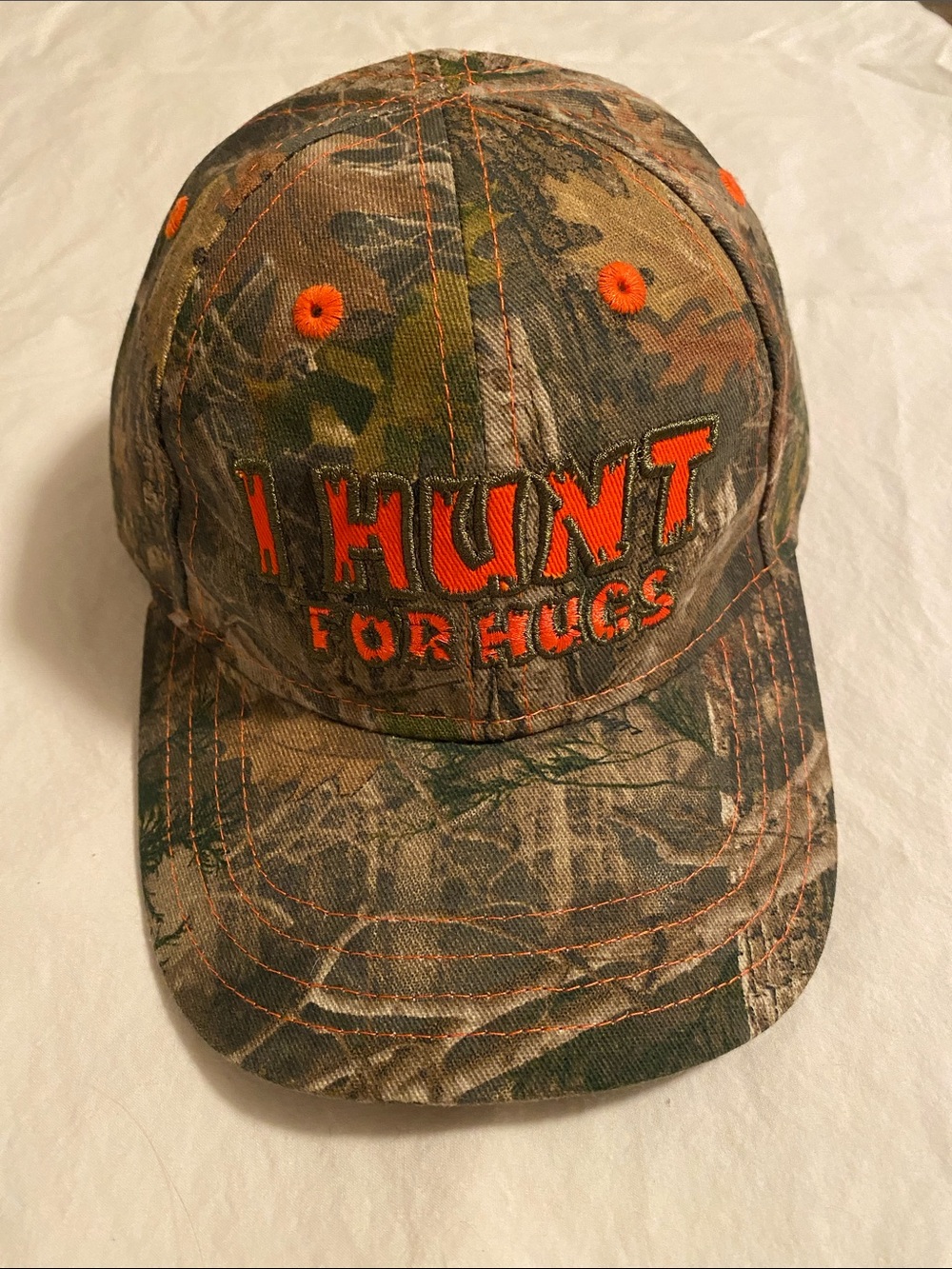 Camouflage Baseball Cap "I Hunt For Hugs" - Orange Accent